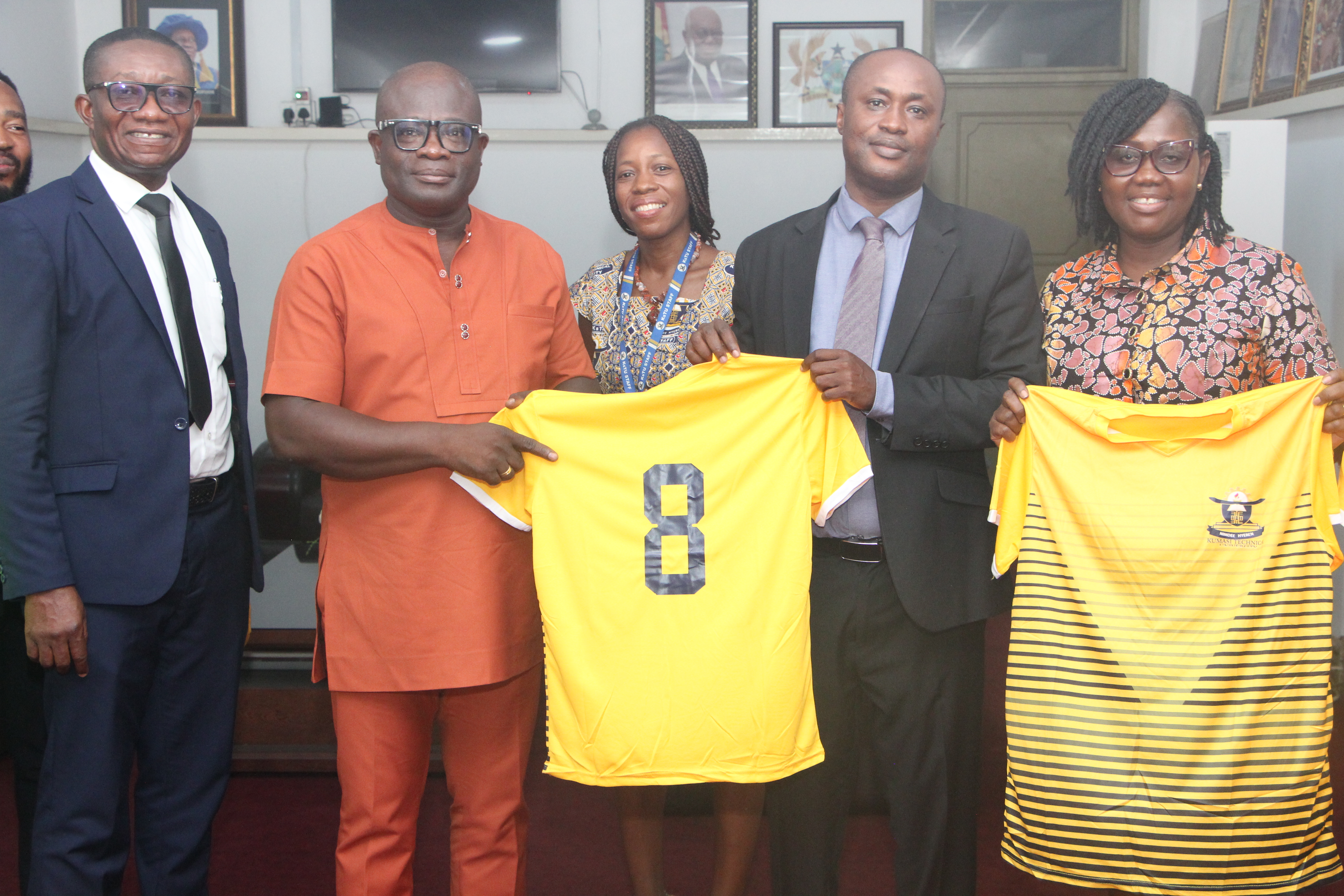 Nana Duku Displays number 8 jersy